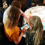 A team enjoying an iPad quiz from Cluego