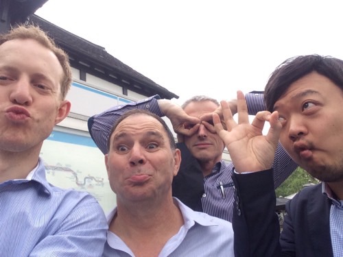A team taking a funny selfie for a Cluego team building game