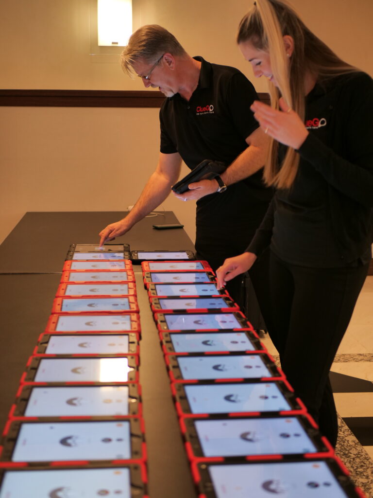 ClueGo staff laying out ipads for a gps treasure hunt